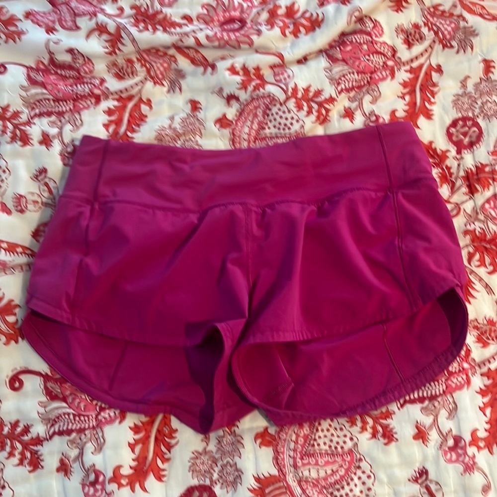 Size 4 2.5 inch Lululemon speed ups. Good condition RIPENED RASPBERRY